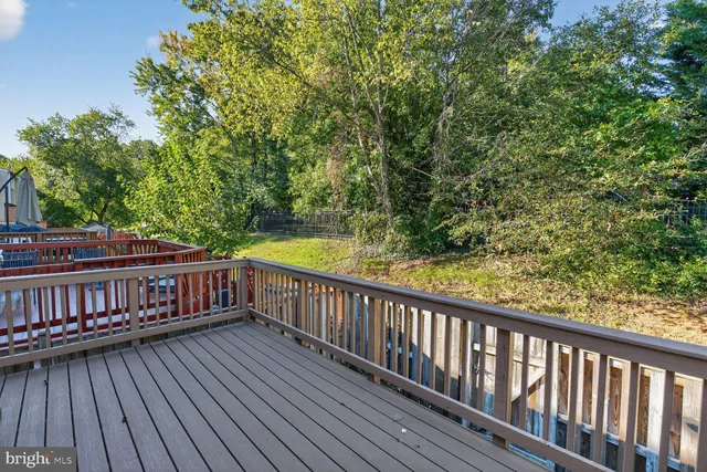 a view of balcony with wooden floor