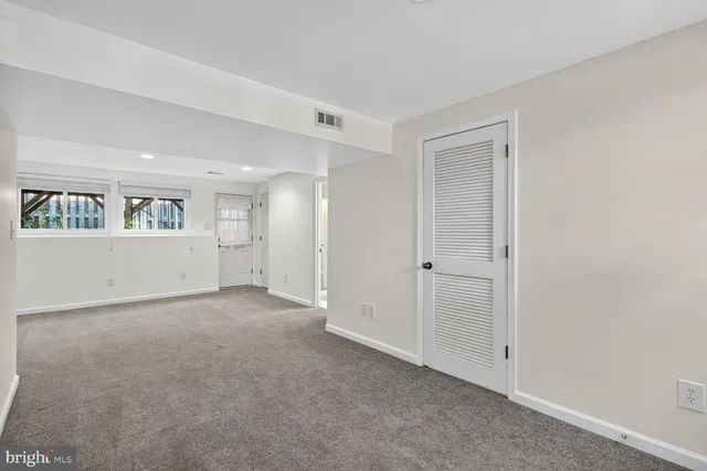 a view of empty room with windows