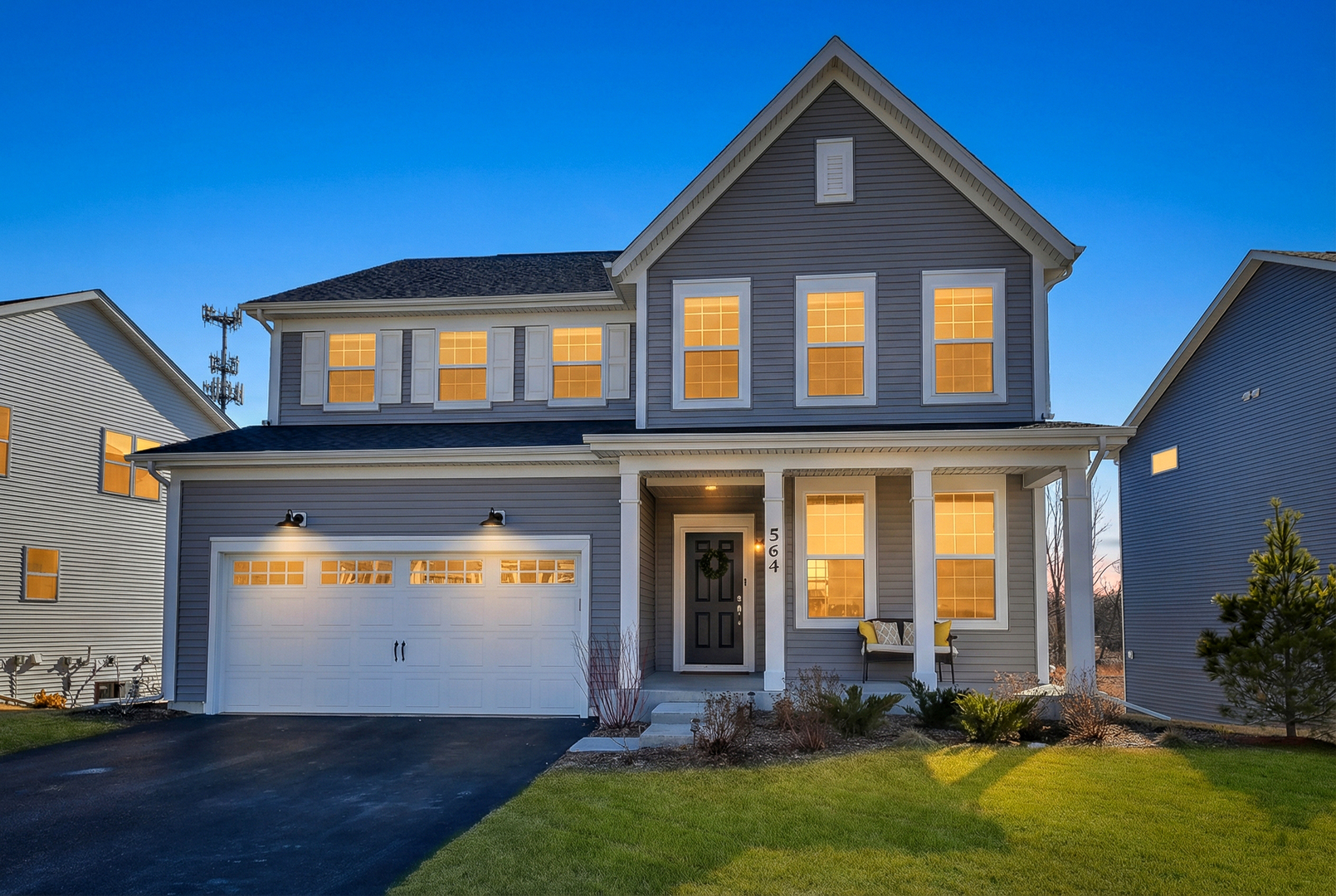 a front view of a house with a yard