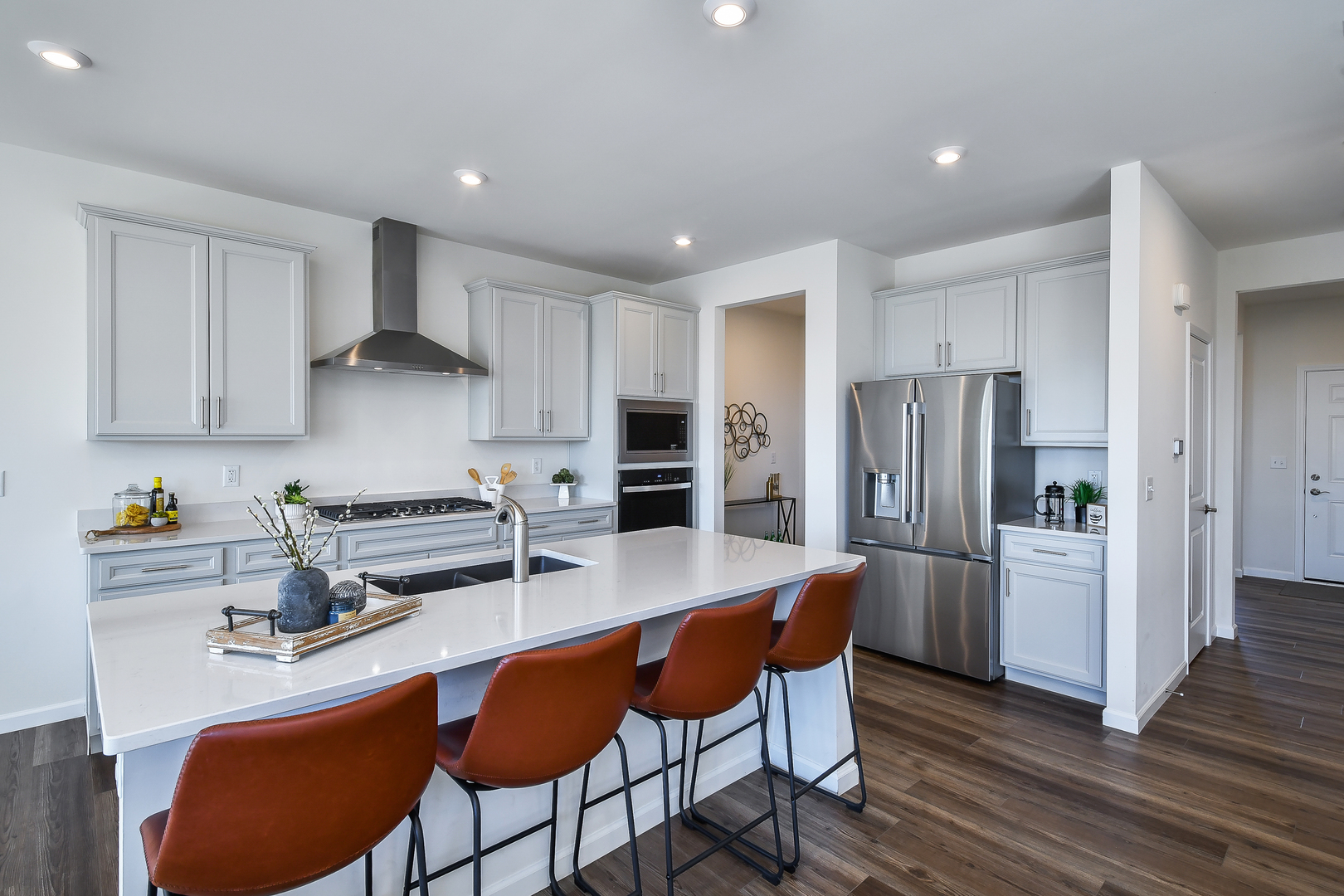 564 Thorne Street Batavia, IL 60510 - Photo 20 of 29 a kitchen with stainless steel appliances a dining table chairs refrigerator and cabinets