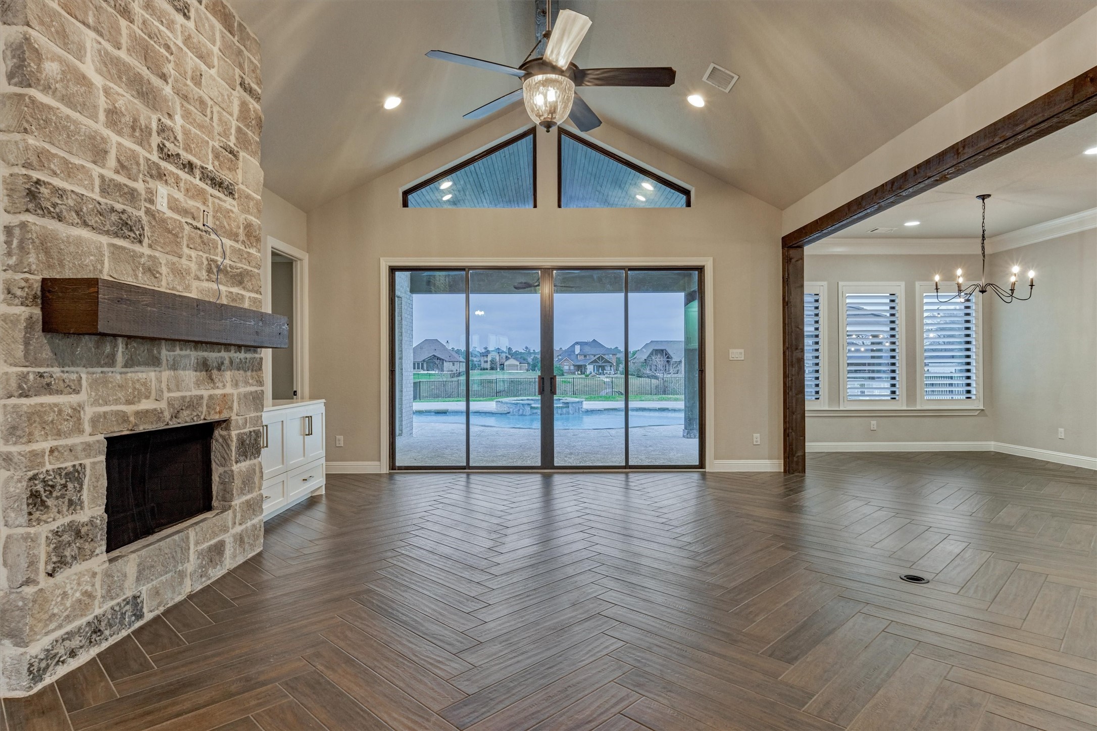 11618 Renaissance Drive Montgomery, TX 77356 - Photo 9 of 49 Sliding glass doors in the living room overlook the pool area, backyard and lake.