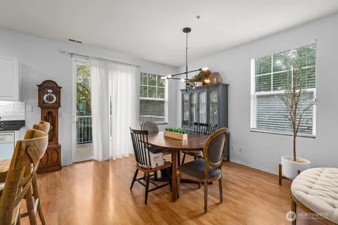 a view of a dining room with furniture window and wooden floor