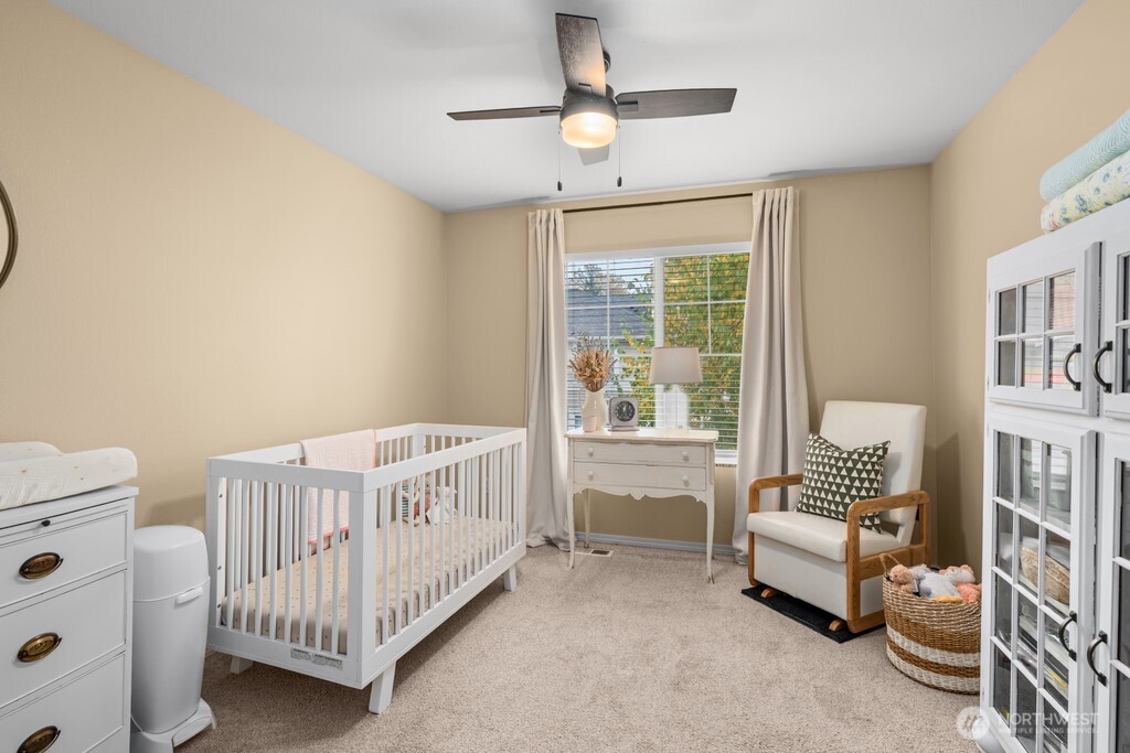 23228 59th Court South Kent, WA 98032 - Photo 19 of 31 a bedroom with a bed and a window