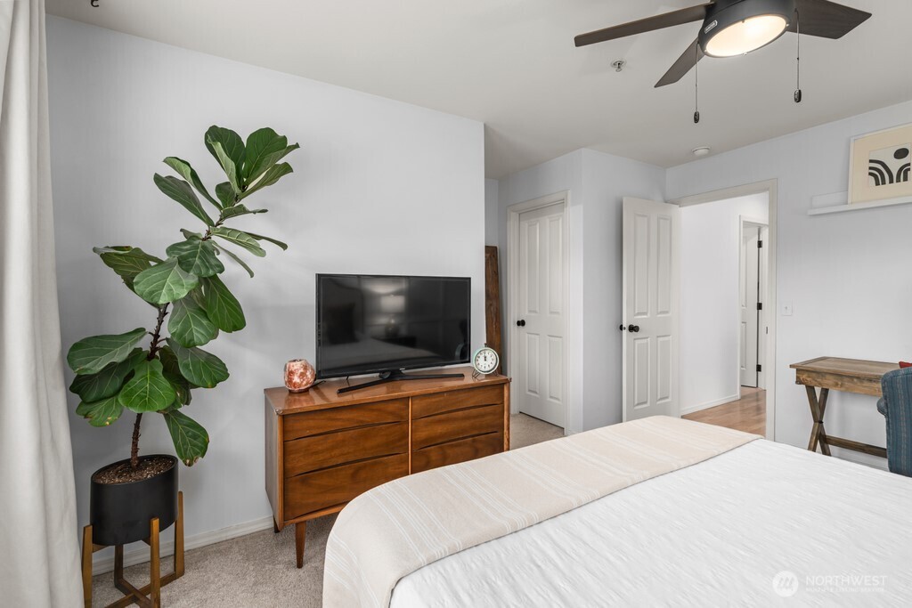 23228 59th Court South Kent, WA 98032 - Photo 20 of 31 a bedroom with a bed and a potted plant