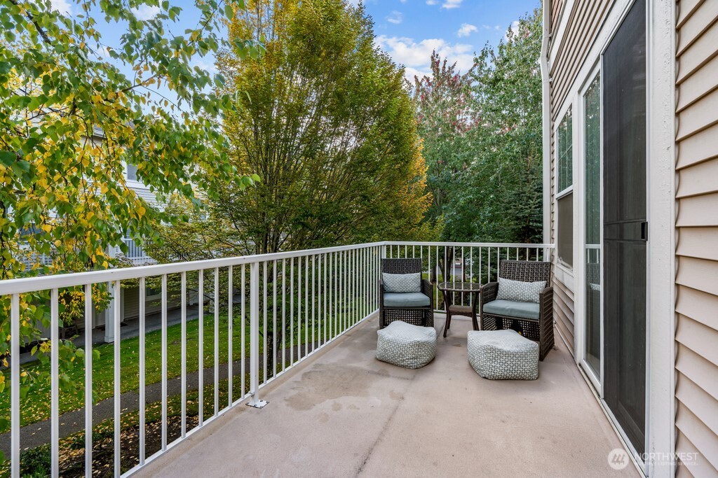 23228 59th Court South Kent, WA 98032 - Photo 27 of 31 a view of a two chairs and table in the balcony