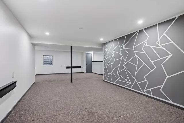 a view of an empty room with stairs