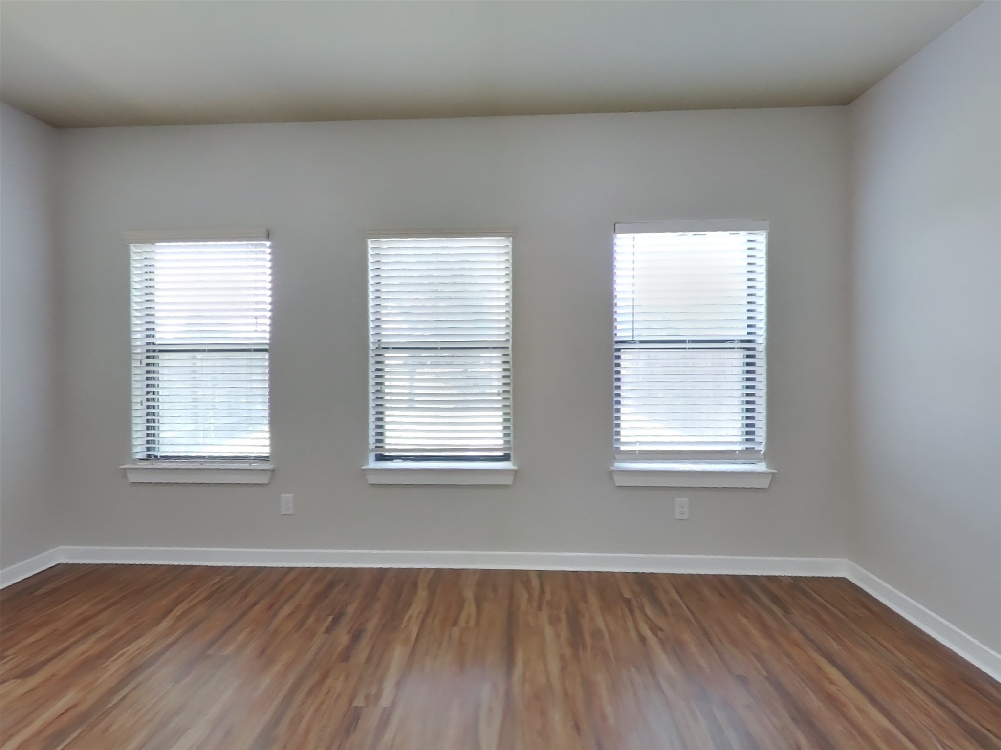 1819 Jara Court Spring, TX 77388 - Photo 3 of 19 an empty room with wooden floor and windows