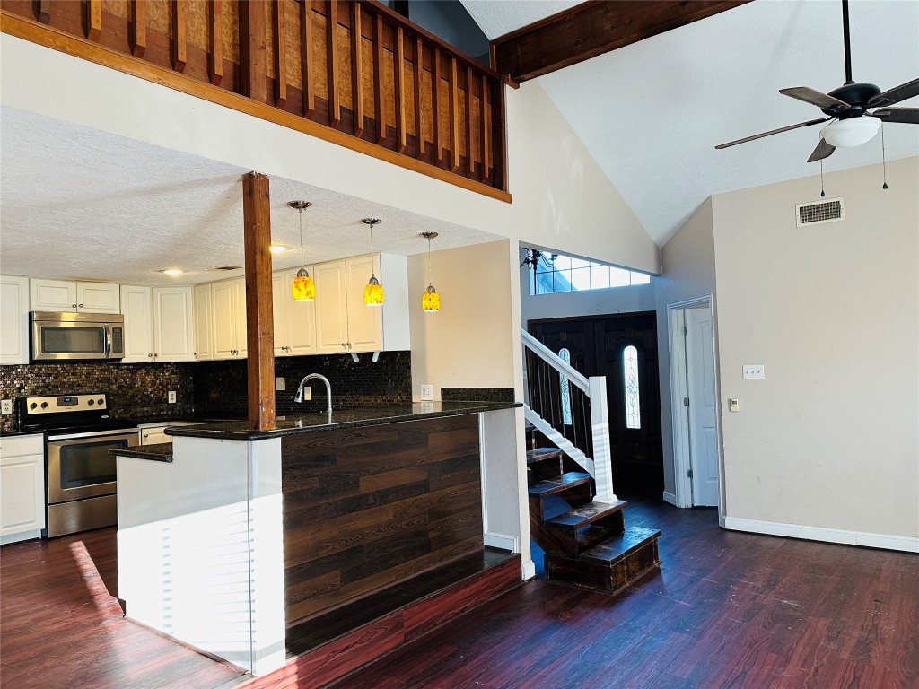 25417 Highway 6 Hempstead, TX 77445 - Photo 16 of 48 a view of a hallway with wooden floor and staircase
