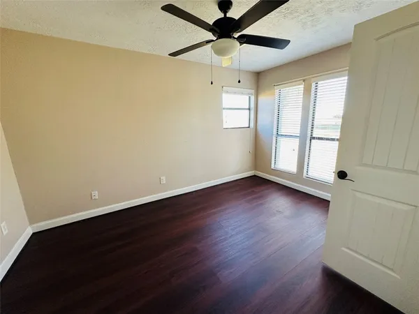 a view of kitchen with cabinets and wooden floor