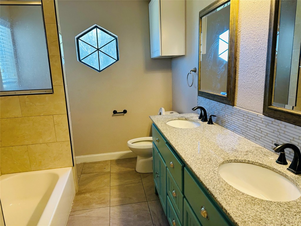 25417 Highway 6 Hempstead, TX 77445 - Photo 30 of 48 a bathroom with a granite countertop sink and a mirror