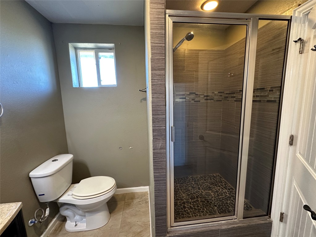 25417 Highway 6 Hempstead, TX 77445 - Photo 40 of 48 a bathroom with a toilet and a shower