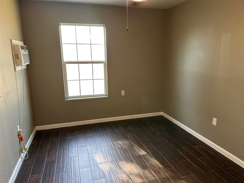 25417 Highway 6 Hempstead, TX 77445 - Photo 42 of 48 an empty room with wooden floor and windows