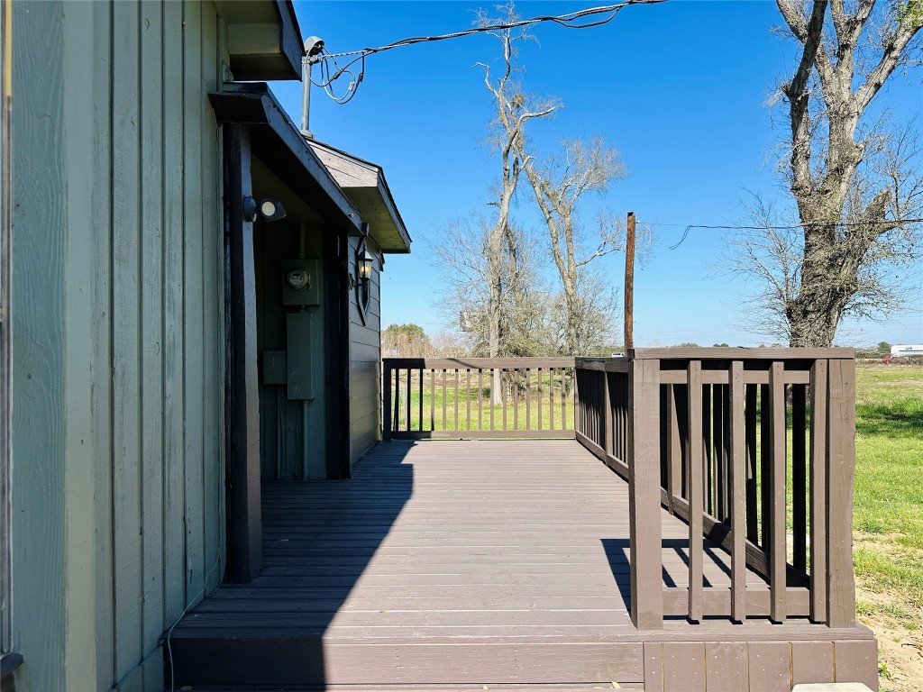 25417 Highway 6 Hempstead, TX 77445 - Photo 7 of 48 a view of a balcony with wooden floor and fence