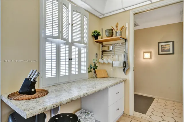 a kitchen with sink and window