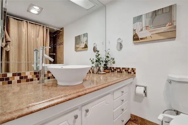 a bathroom with sink and mirror