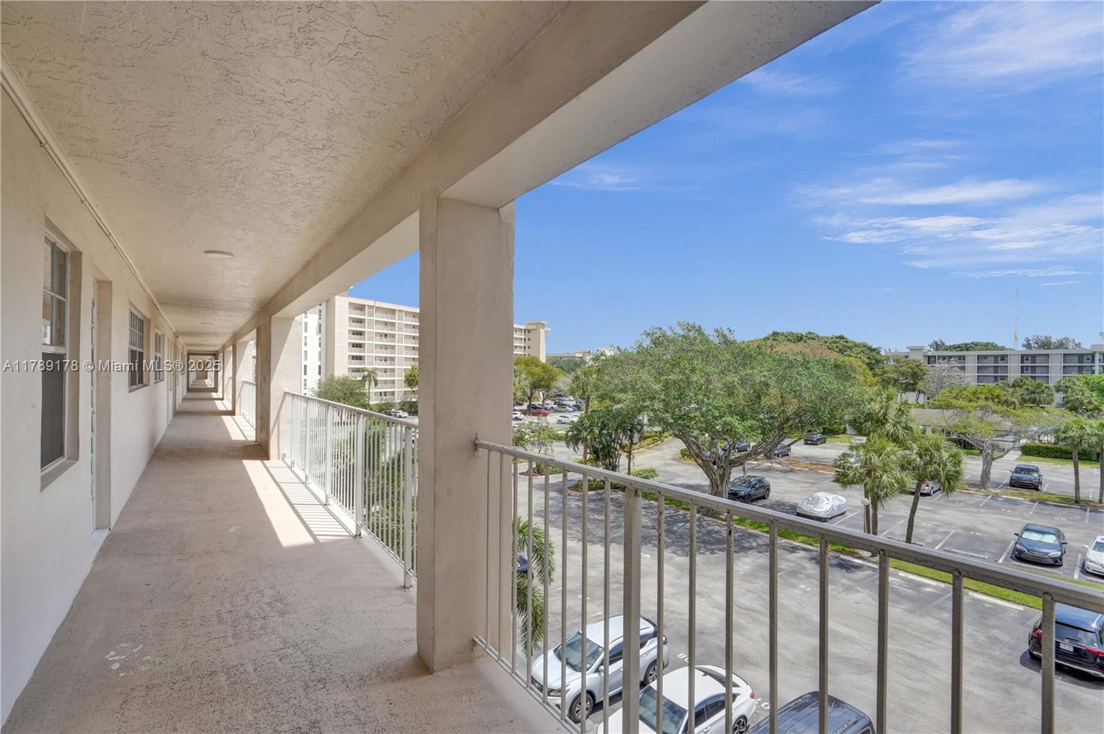 2671 South Course Drive, Unit 409 Pompano Beach, FL 33069 - Photo 35 of 45 a view of a balcony with city view