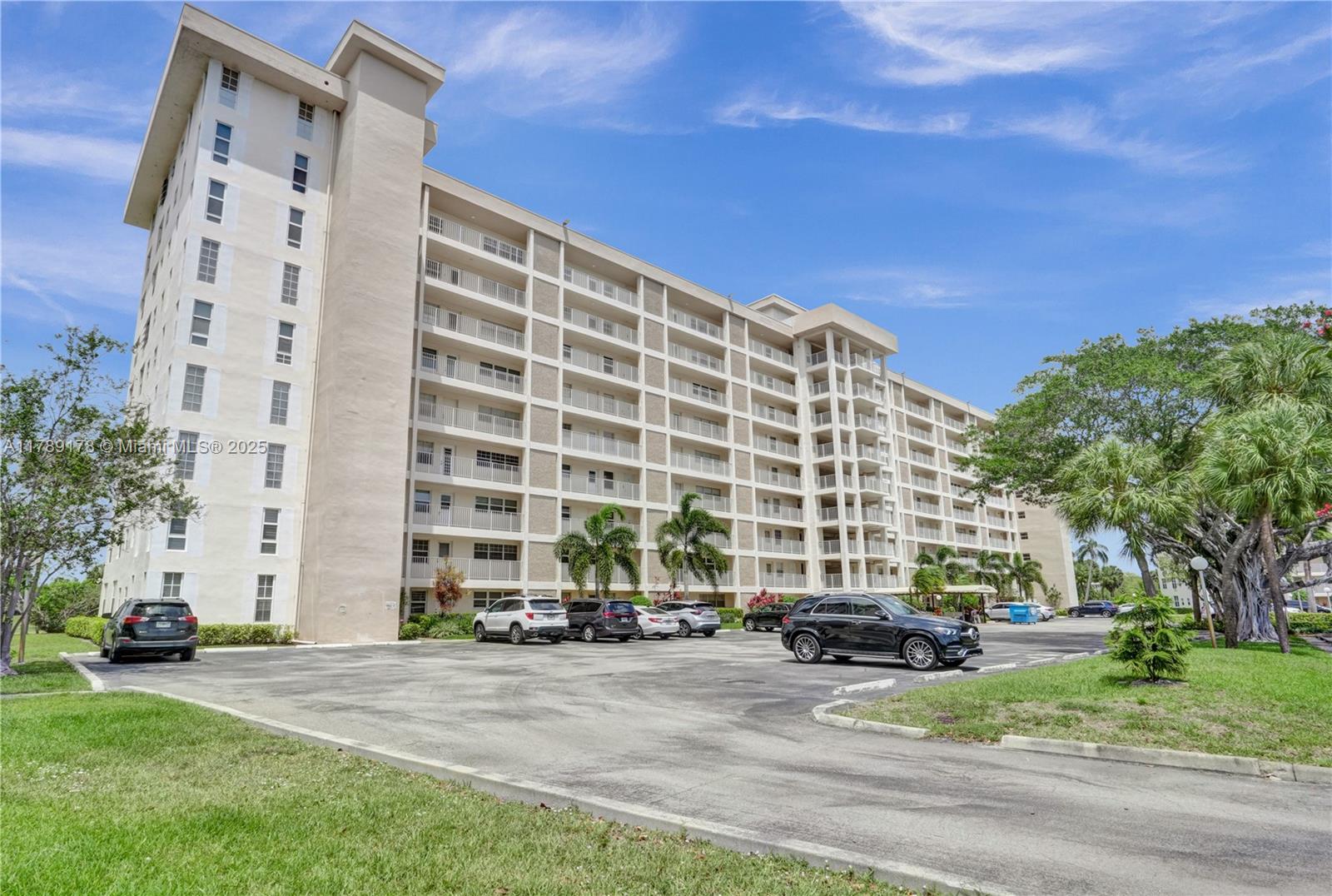2671 South Course Drive, Unit 409 Pompano Beach, FL 33069 - Photo 36 of 45 front view of a building with a street