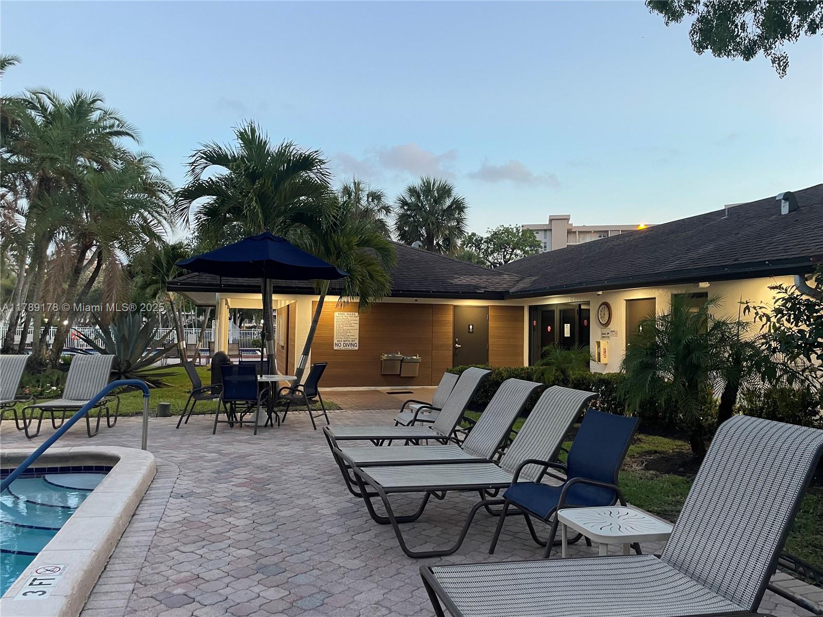 2671 South Course Drive, Unit 409 Pompano Beach, FL 33069 - Photo 38 of 45 a view of outdoor space yard and patio