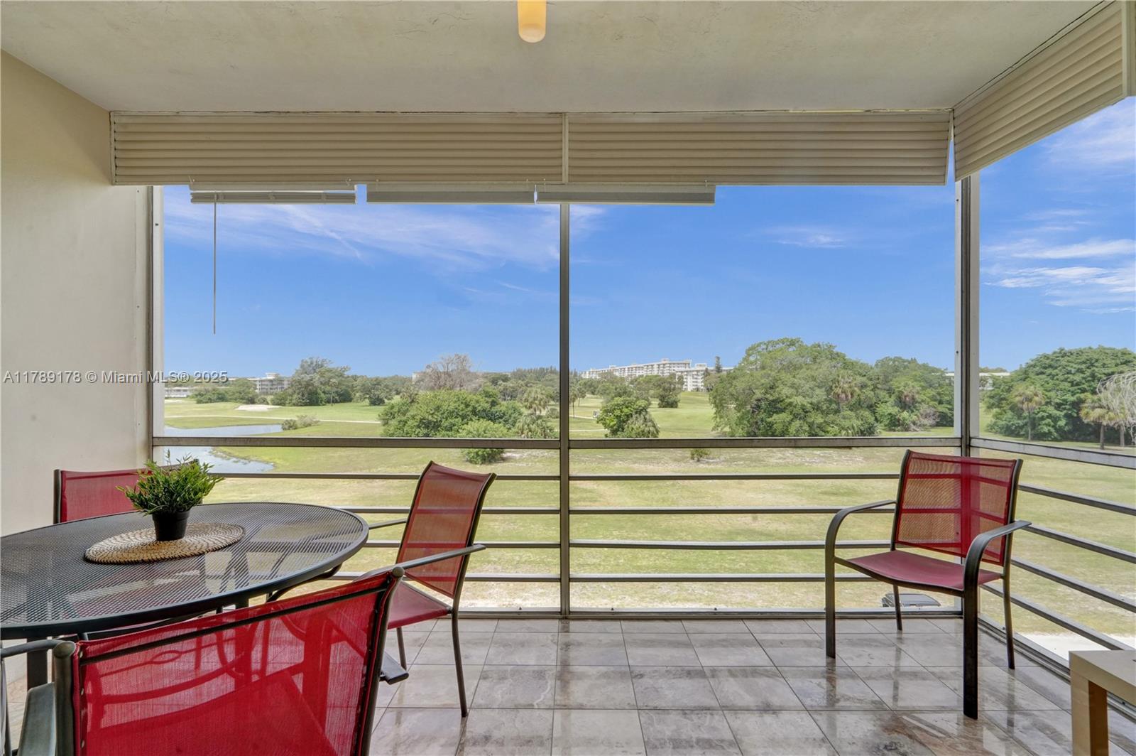 2671 South Course Drive, Unit 409 Pompano Beach, FL 33069 - Photo 8 of 45 a view of a outdoor seating area with furniture