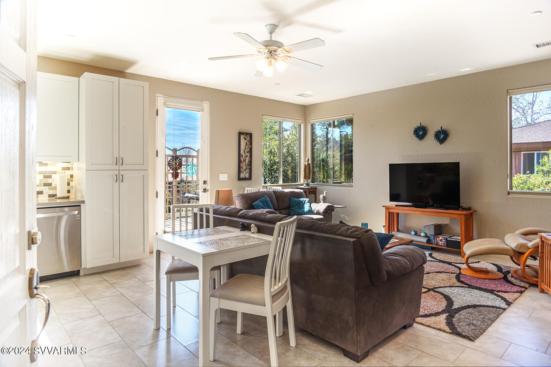 25 Ranch Road Sedona, AZ 86336 - Photo 19 of 36 a living room with furniture a flat screen tv and a window