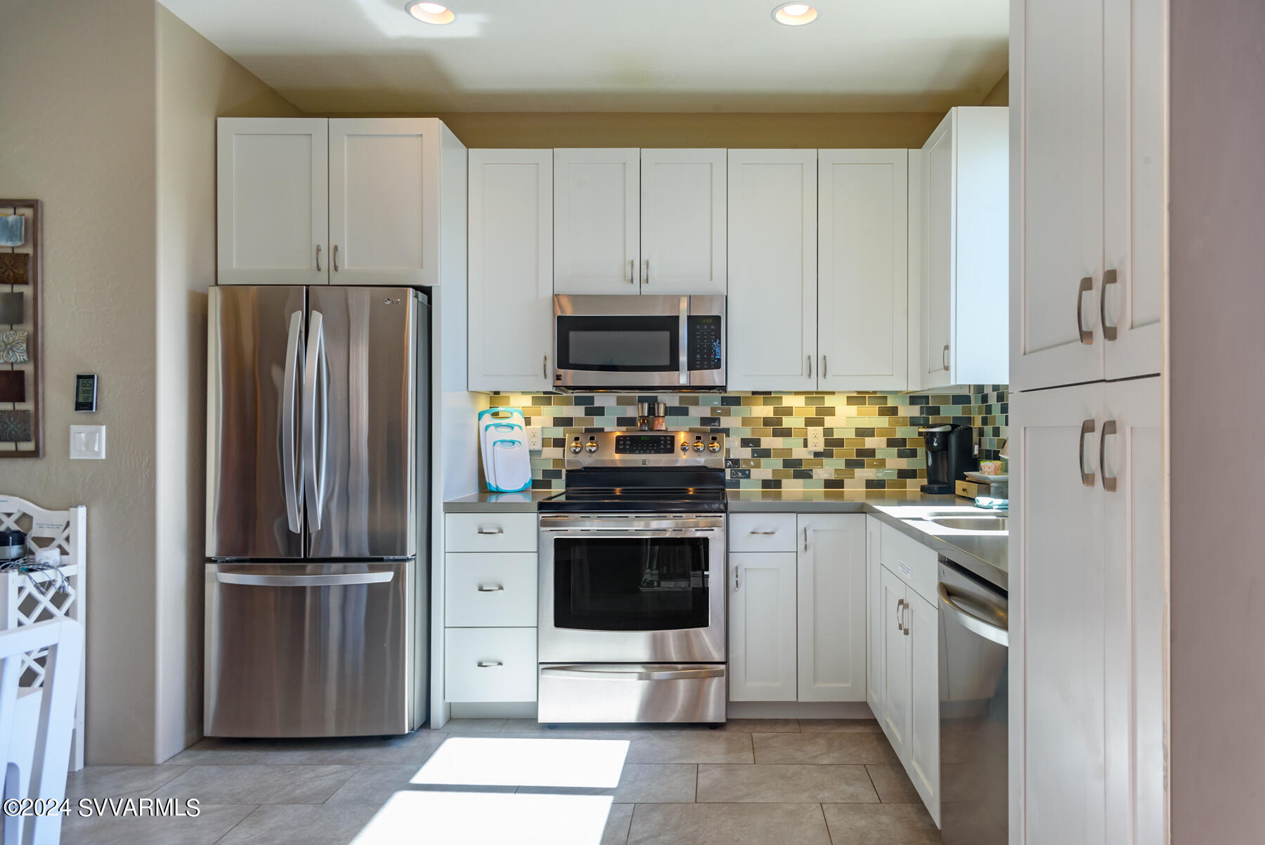 25 Ranch Road Sedona, AZ 86336 - Photo 20 of 36 a kitchen with stainless steel appliances and cabinets