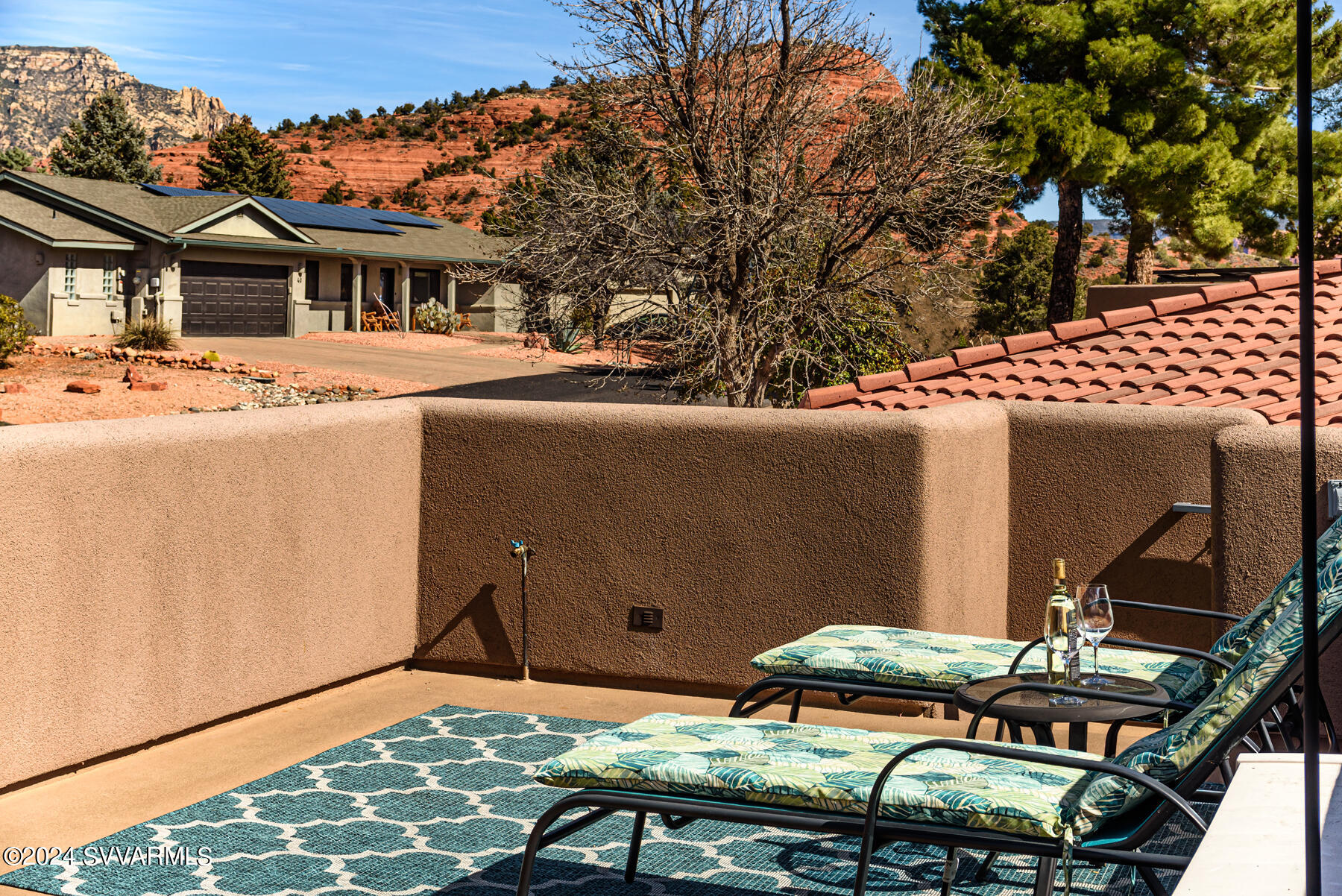 25 Ranch Road Sedona, AZ 86336 - Photo 27 of 36 a backyard of a house with table and chairs