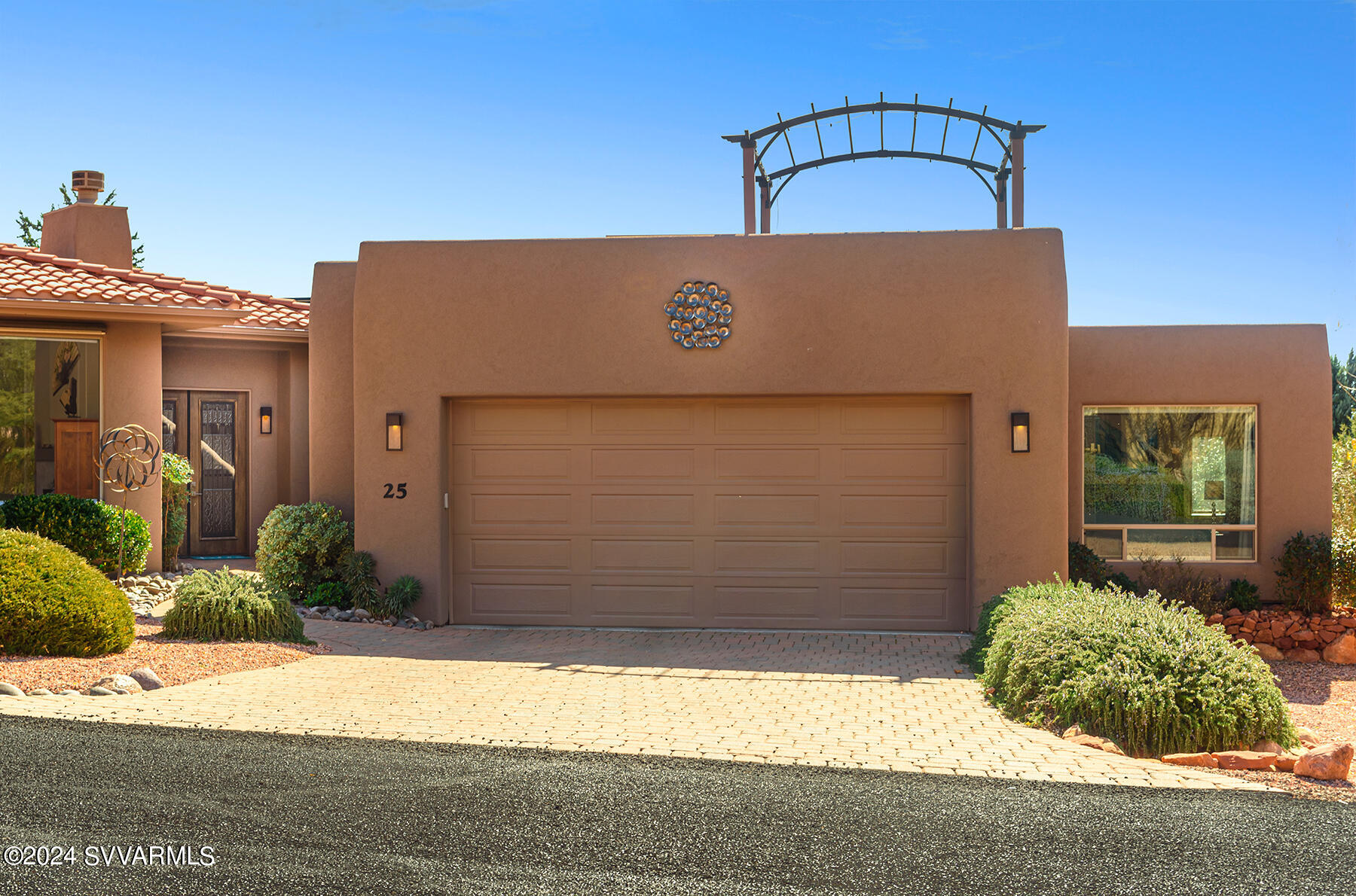 25 Ranch Road Sedona, AZ 86336 - Photo 32 of 36 a view of a brick house with a small yard