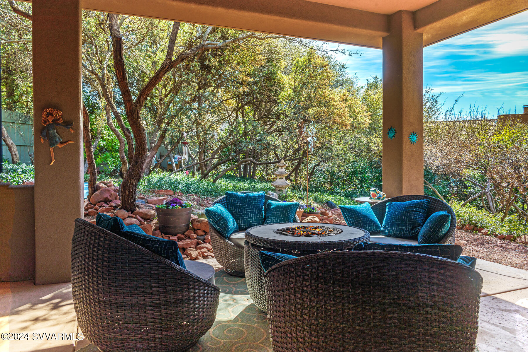 25 Ranch Road Sedona, AZ 86336 - Photo 8 of 36 a view of a patio with couches chairs and a potted plant