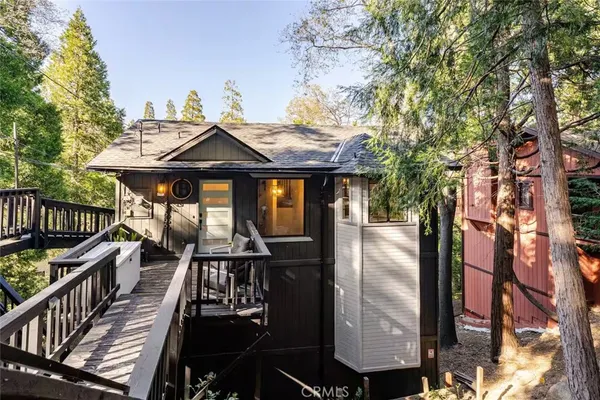 a terrace with outdoor seating and wooden floor