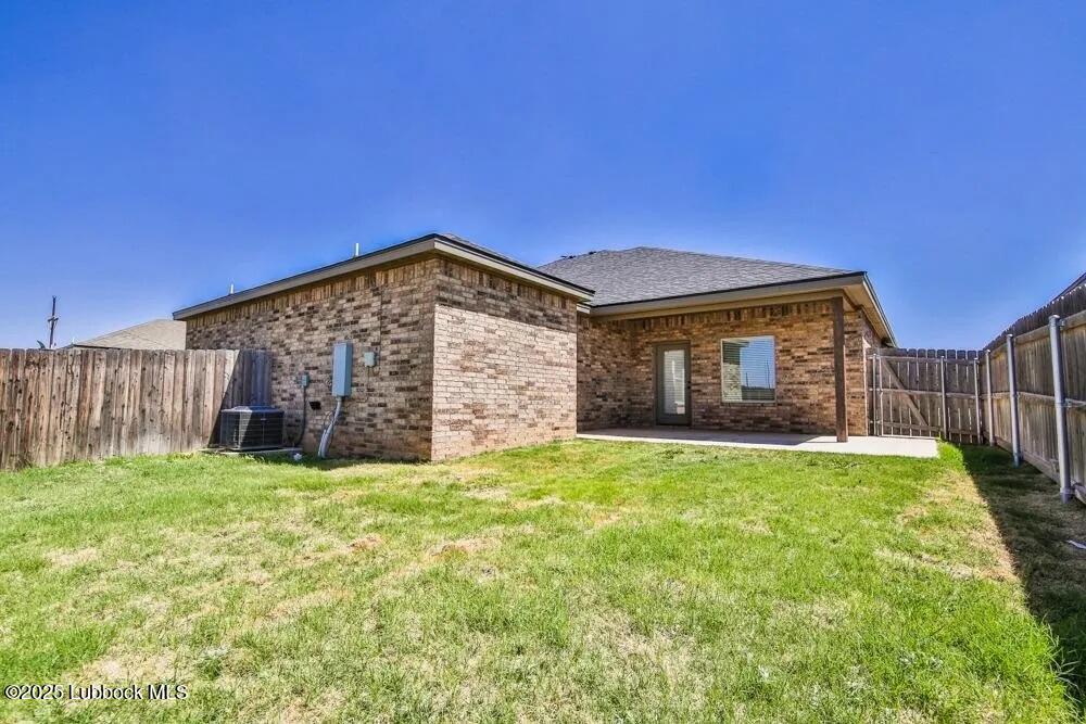 1602 102nd Street Lubbock, TX 79423 - Photo 15 of 16 a view of a house with a yard