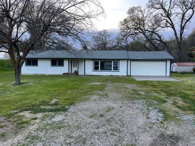 18690 Reeds Creek Road Red Bluff, CA 96080 - Photo 1 of 23 a house with garden in front of it