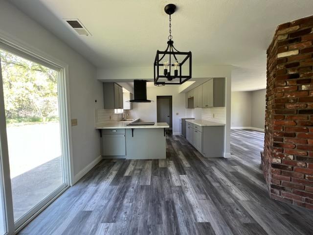 18690 Reeds Creek Road Red Bluff, CA 96080 - Photo 11 of 23 a kitchen with kitchen island stainless steel appliances a sink window and wooden floor