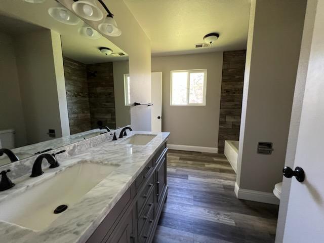 18690 Reeds Creek Road Red Bluff, CA 96080 - Photo 19 of 23 a bathroom with a granite countertop sink and a mirror