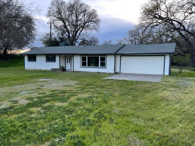 18690 Reeds Creek Road Red Bluff, CA 96080 - Photo 2 of 23 a front view of a house with yard and trees