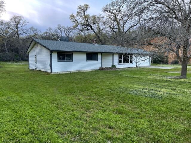 18690 Reeds Creek Road Red Bluff, CA 96080 - Photo 3 of 23 a front view of house with yard and trees
