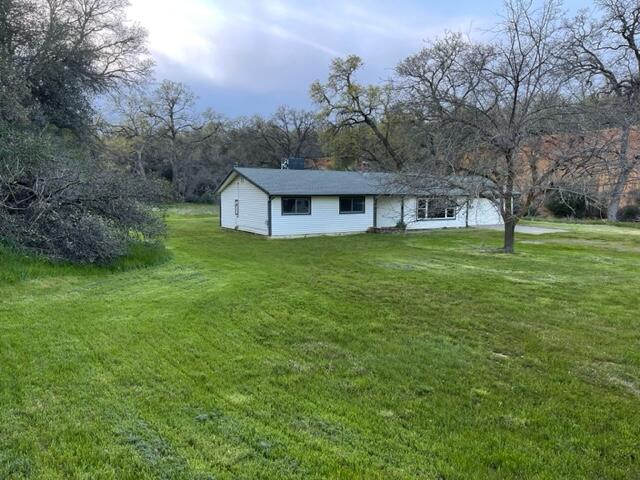 18690 Reeds Creek Road Red Bluff, CA 96080 - Photo 5 of 23 a view of a house with a big yard