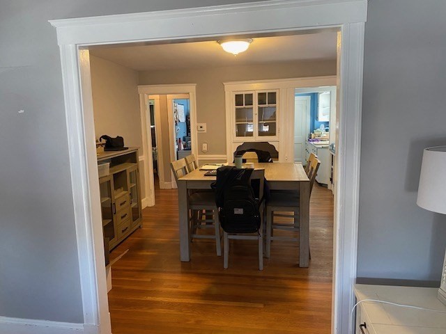70 Prospect Street, Unit 70 Watertown, MA 02472 - Photo 2 of 9 a dining room with furniture and wooden floor
