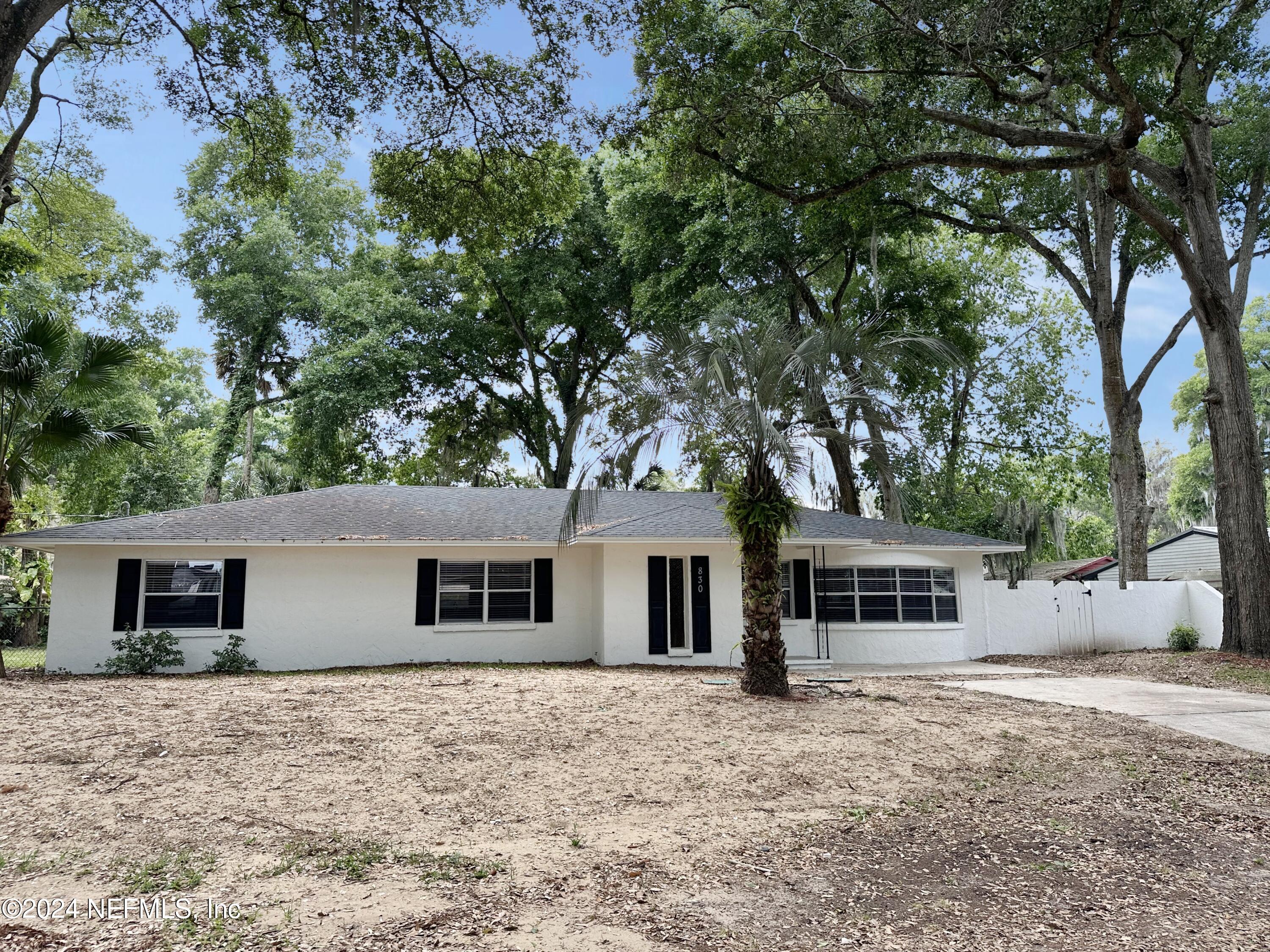 830 Gerona Road St. Augustine, FL 32086 - Photo 1 of 27 front view of a house with a yard and an trees