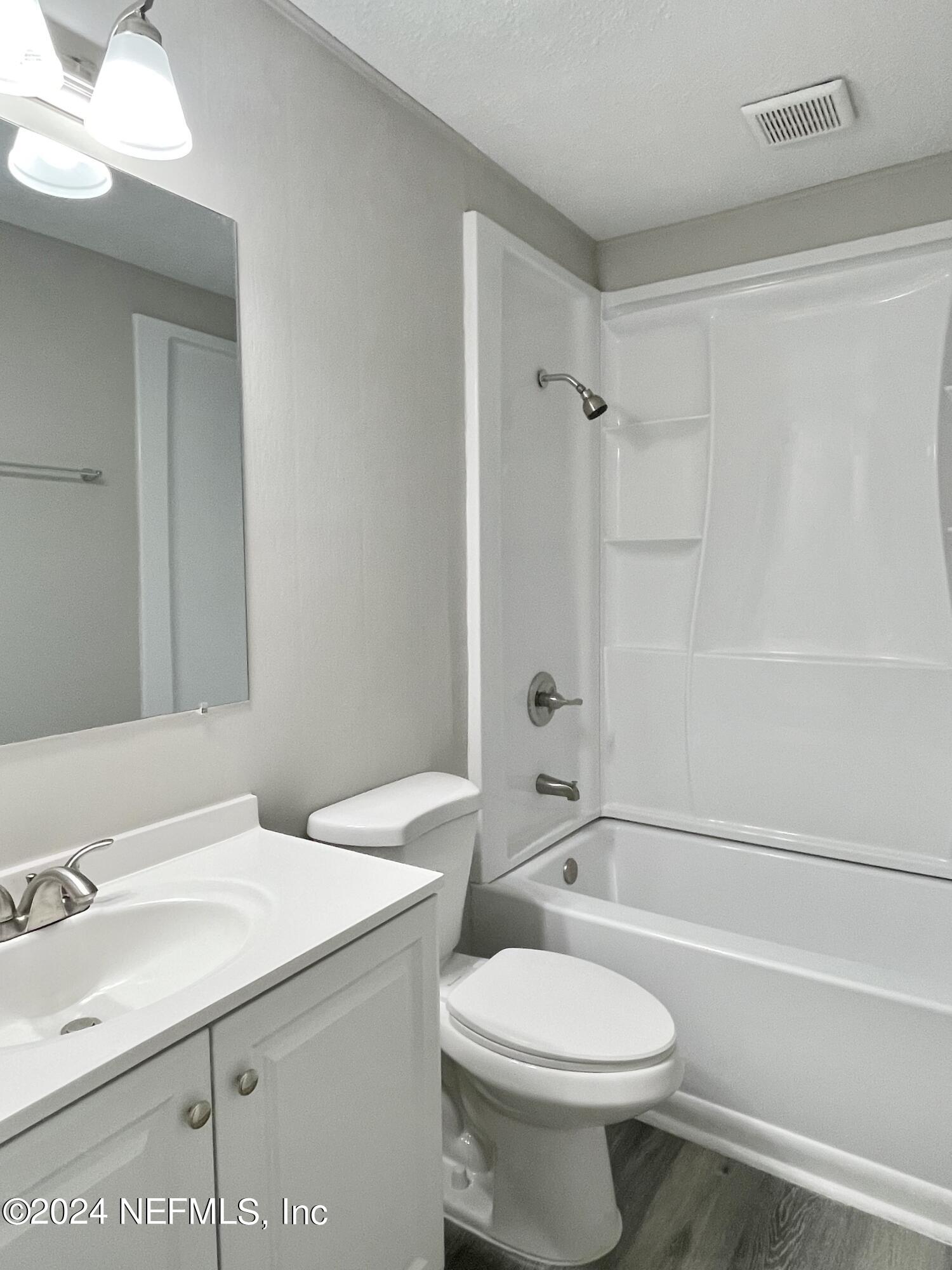 830 Gerona Road St. Augustine, FL 32086 - Photo 17 of 27 a bathroom with a sink a toilet and a bathtub