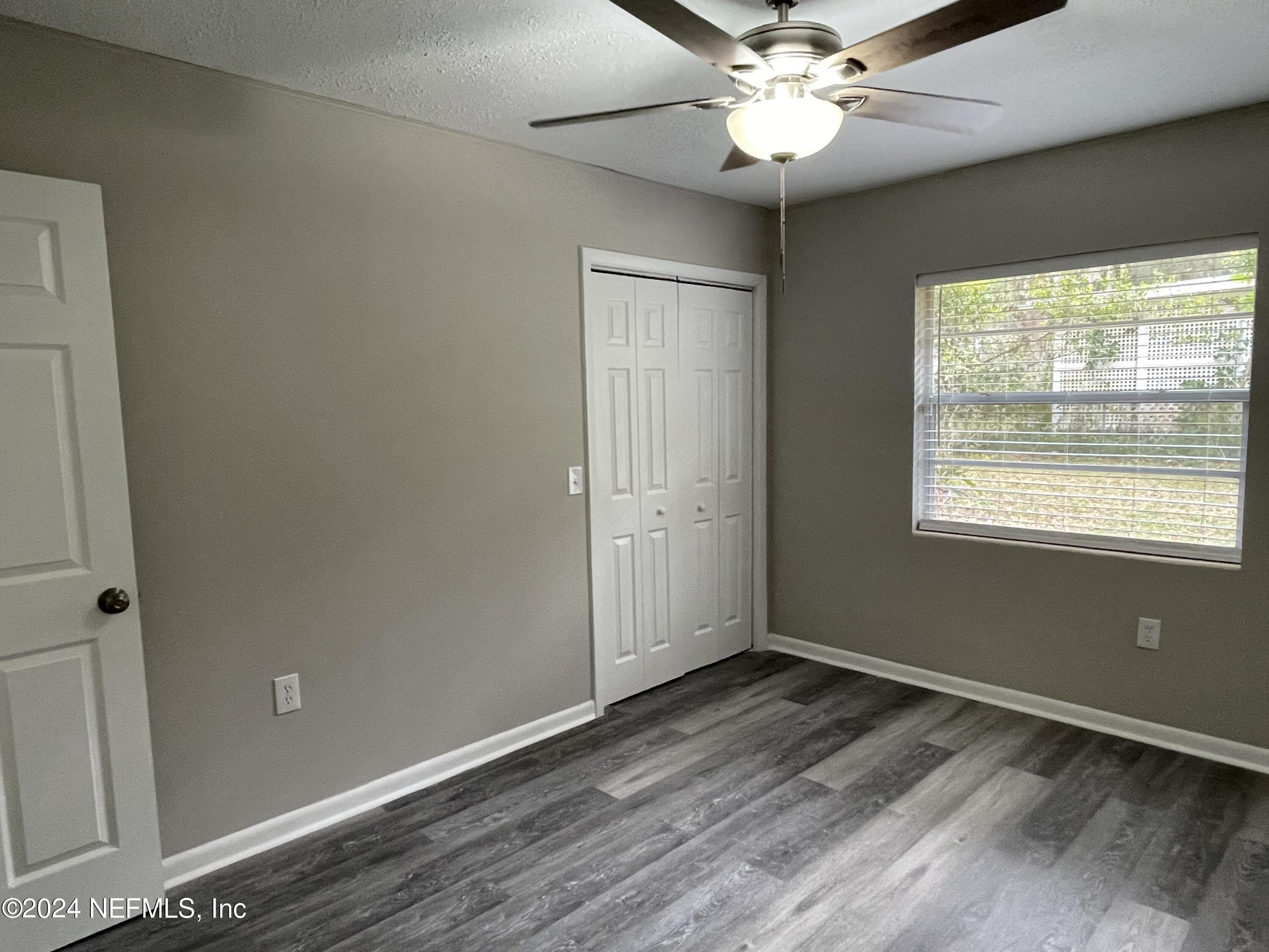 830 Gerona Road St. Augustine, FL 32086 - Photo 18 of 27 a view of an empty room with a window
