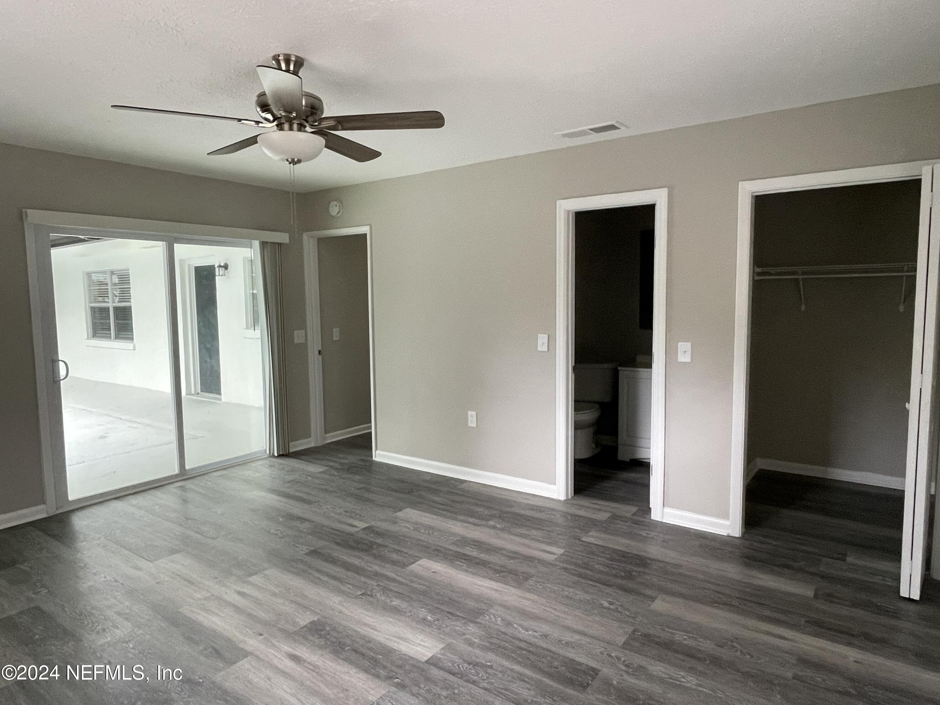 830 Gerona Road St. Augustine, FL 32086 - Photo 20 of 27 a view of an empty room with wooden floor