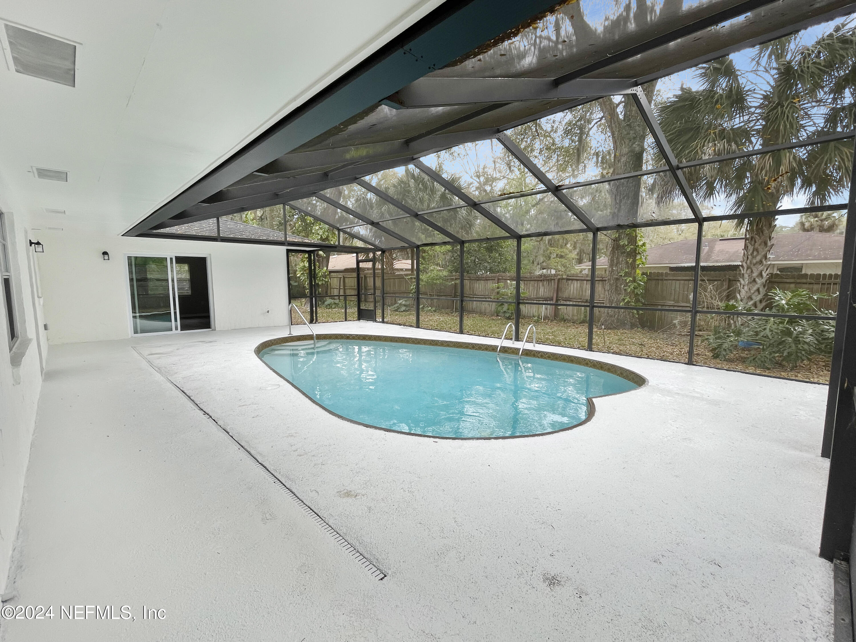 830 Gerona Road St. Augustine, FL 32086 - Photo 24 of 27 a view of a swimming pool with a yard