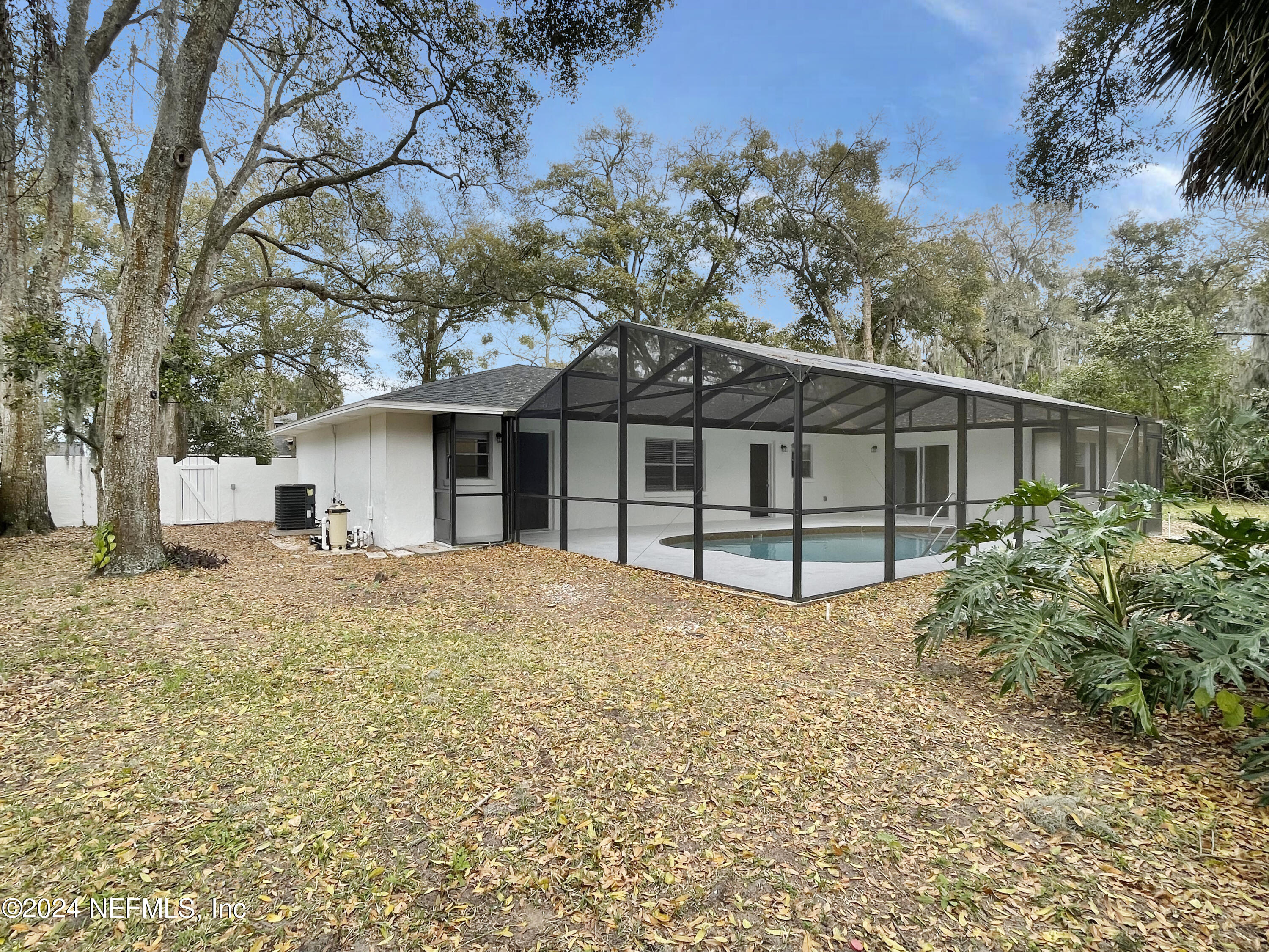 830 Gerona Road St. Augustine, FL 32086 - Photo 26 of 27 a house with trees in the background