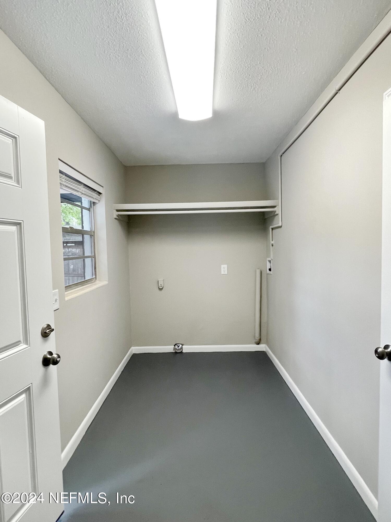 830 Gerona Road St. Augustine, FL 32086 - Photo 8 of 27 an empty room with a windows and closet