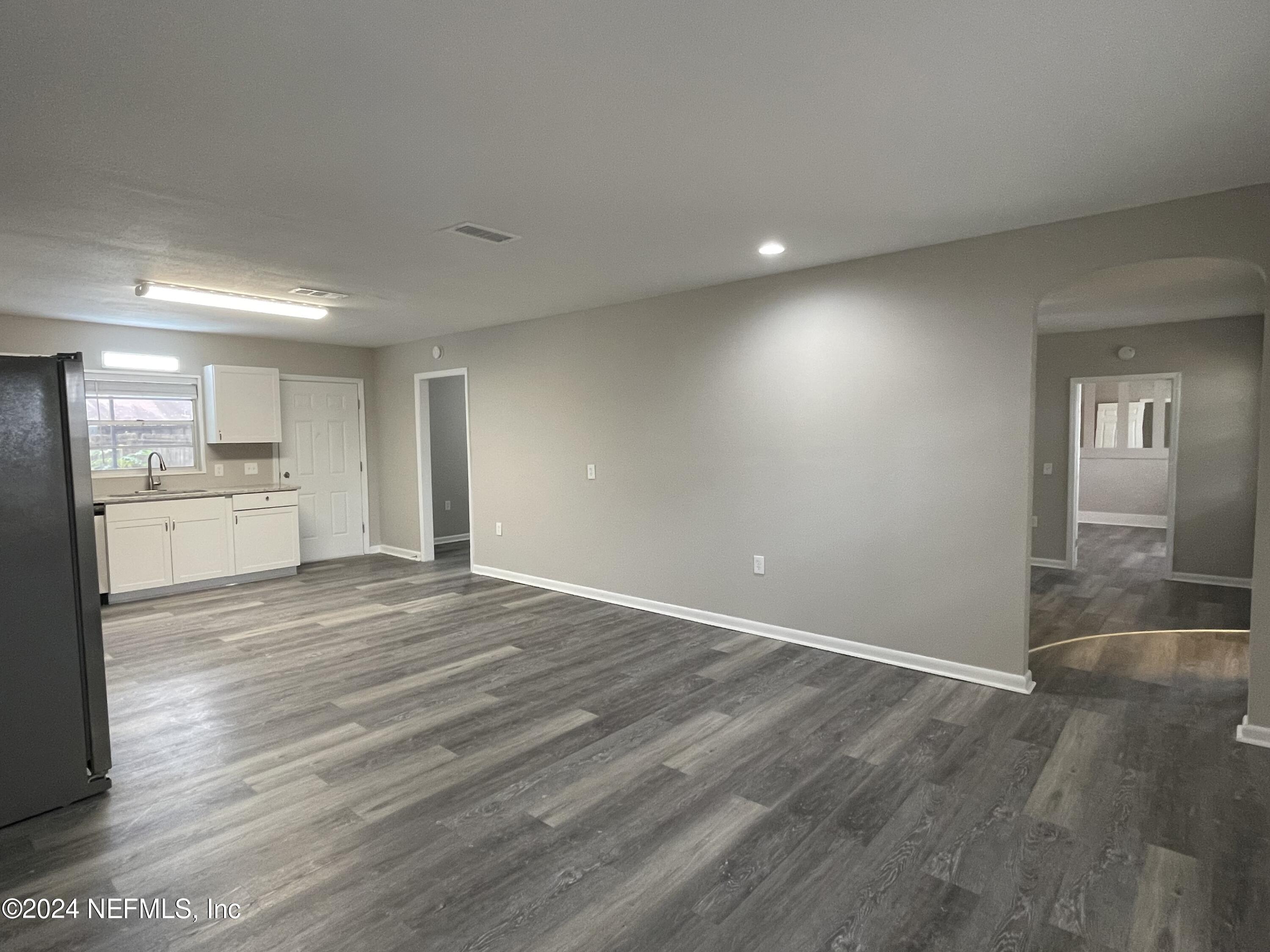 830 Gerona Road St. Augustine, FL 32086 - Photo 10 of 27 a view of a kitchen with a sink and wooden floor