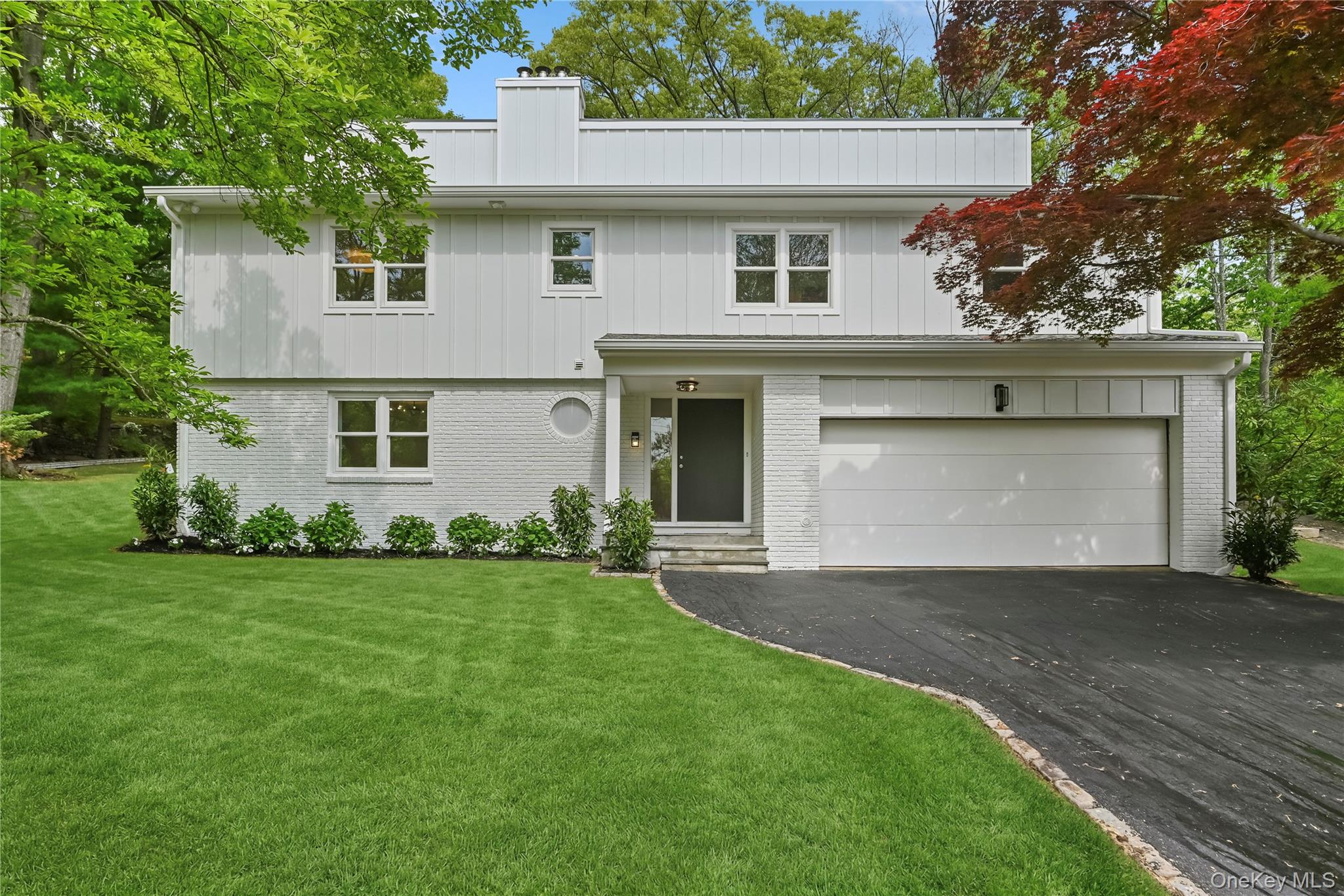 front view of a house with a yard
