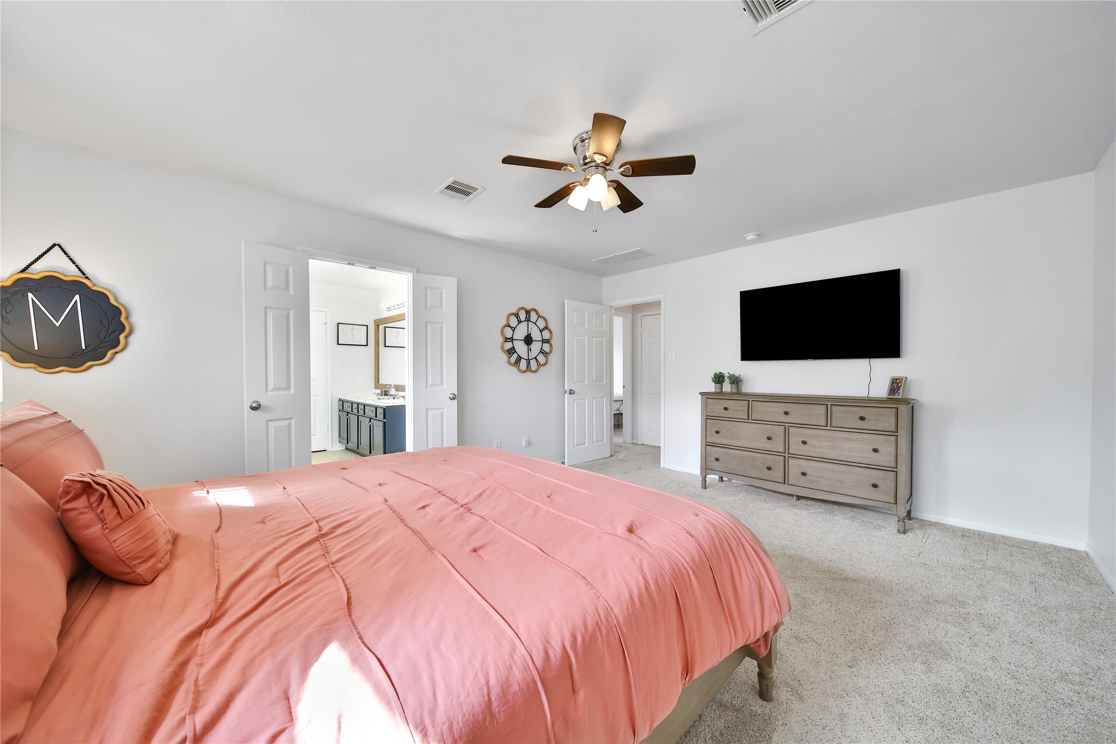 1279 Pinto Pass Alvin, TX 77511 - Photo 17 of 31 a bedroom with a bed and a flat screen tv