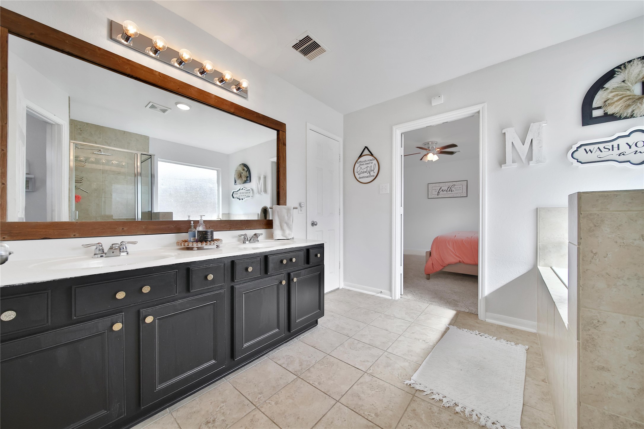 1279 Pinto Pass Alvin, TX 77511 - Photo 18 of 31 a spacious bathroom with a double vanity sink a mirror and a shower