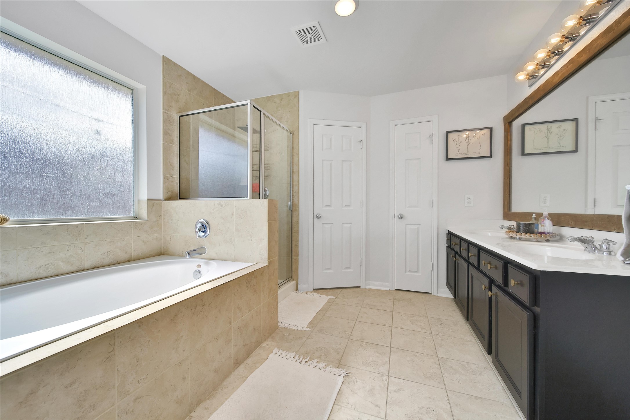 1279 Pinto Pass Alvin, TX 77511 - Photo 19 of 31 a spacious bathroom with a tub sink and mirror