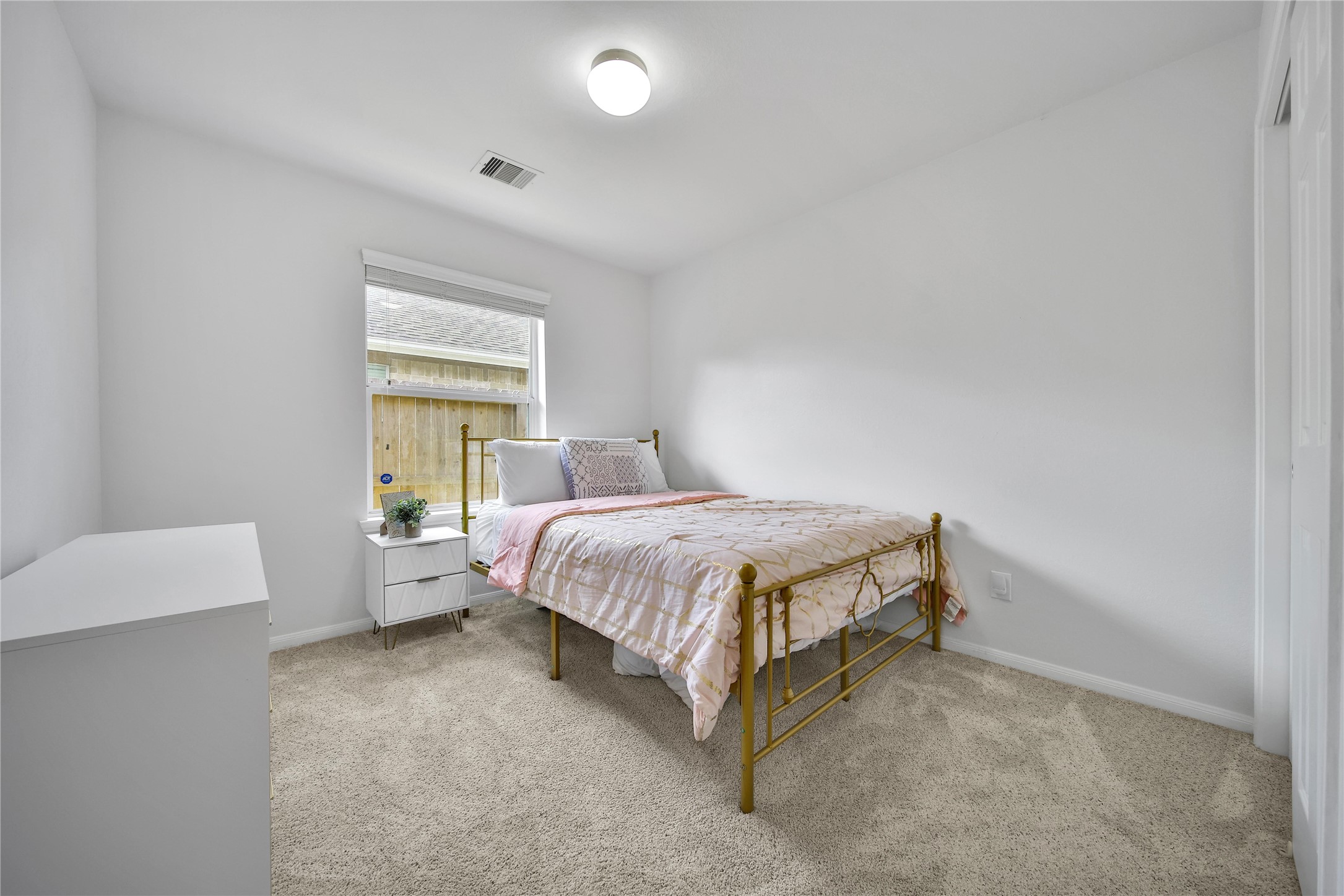 1279 Pinto Pass Alvin, TX 77511 - Photo 21 of 31 a spacious bedroom with a bed and a window